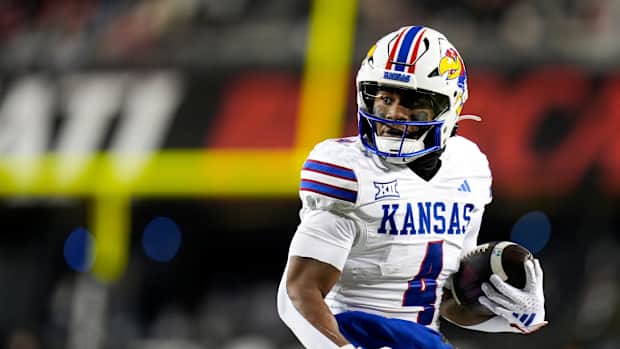 Kansas Jayhawks running back Devin Neal (4) scores a touch down during the NCAA college football game between the Cincinnati Bearcats and Kansas Jayhawks on Saturday, Nov. 25, 2023, at Nippert Stadium in Cincinnati. This is the Bearcats last game of the season, as well as their Senior Night Saturday