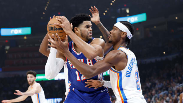 Nov 25, 2023; Oklahoma City, Oklahoma, USA; Oklahoma City Thunder guard Shai Gilgeous-Alexander (2) defends a drive by Philadelphia 76ers forward Tobias Harris (12) during the first quarter at Paycom Center.