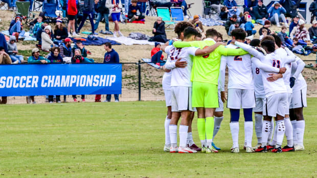 The Virginia men's soccer team huddles during the match against Indiana in the Round of 16 at the NCAA Men's Soccer Championship.