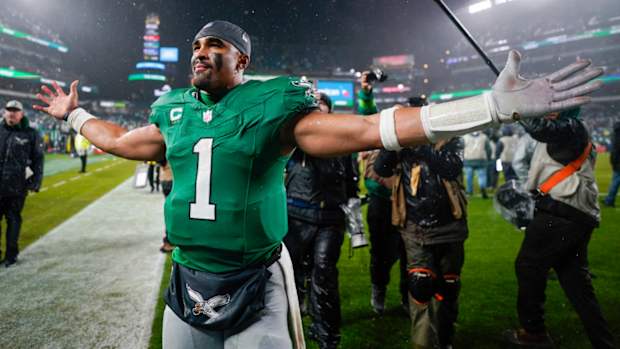 Philadelphia Eagles quarterback Jalen Hurts celebrates after scoring the game winning touchdown against the Buffalo Bills during overtime in an NFL football game Sunday, Nov. 26, 2023, in Philadelphia. (AP Photo/Matt Slocum)   