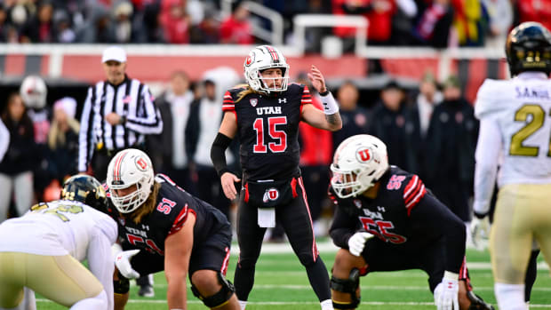 Nov 25, 2023; Salt Lake City, Utah, USA; Utah Utes quarterback Luke Bottari (15) calls a play against the Colorado Buffaloes at Rice-Eccles Stadium. Mandatory Credit: Christopher Creveling-USA TODAY Sports