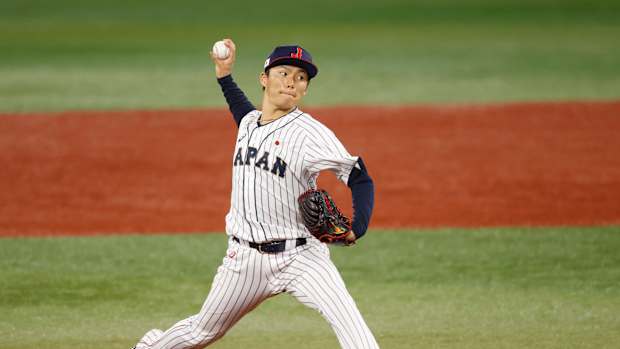 Aug 4, 2021; Yokohama, Japan; Team Japan pitcher Yoshinobu Yamamoto (17) throws a pitch against Korea in a baseball semifinal match during the Tokyo 2020 Olympic Summer Games at Yokohama Baseball Stadium. Mandatory Credit: Yukihito Taguchi-USA TODAY Sports