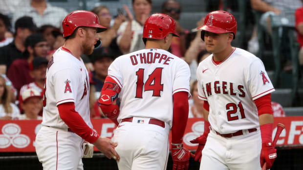 Sep 9, 2023; Anaheim, California, USA; Los Angeles Angels catcher Logan O'Hoppe (14)is greeted by second baseman Brandon Drury (23) and designated hitter Matt Thaiss (21) after hitting a two-run home run during the first inning against the Cleveland Guardians at Angel Stadium. Mandatory Credit: Kiyoshi Mio-USA TODAY Sports  