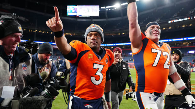 Nov 26, 2023; Denver, Colorado, USA; Denver Broncos quarterback Russell Wilson (3) and offensive tackle Garett Bolles (72) walk off the field following the win over the Cleveland Browns at Empower Field at Mile High.