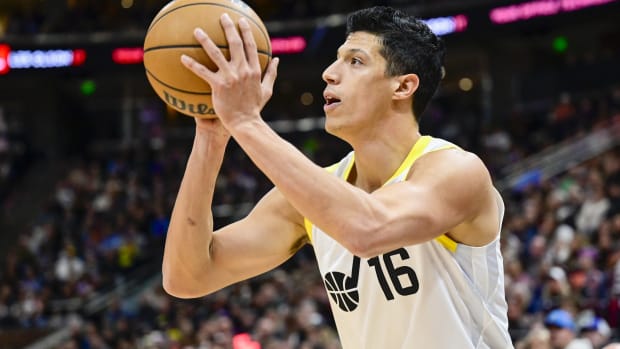 Utah Jazz forward Simone Fontecchio (16) shoots the ball against the New Orleans Pelicans during the first half at Delta Center.