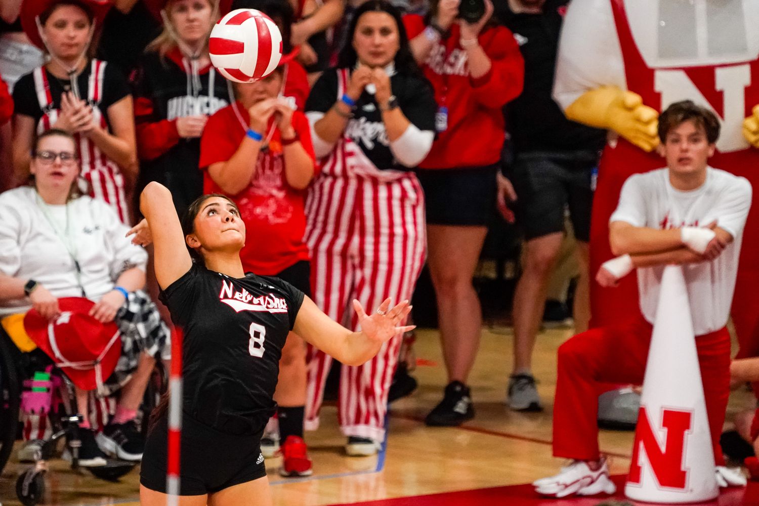 Oct 21, 2023; Lincoln, NE, USA; Nebraska Cornhuskers libero Lexi Rodriguez (8) serves against the Wisconsin Badgers during the fifth set at the Bob Devaney Sports Center.