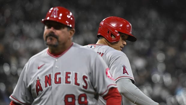 Apr 29, 2022; Chicago, Illinois, USA; Los Angeles Angels designated hitter Shohei Ohtani (17) talks with Los Angeles Angels first base coach Benji Gil (89) after he singles against the Chicago White Sox during the eighth inning at Guaranteed Rate Field. Mandatory Credit: Matt Marton-USA TODAY Sports  