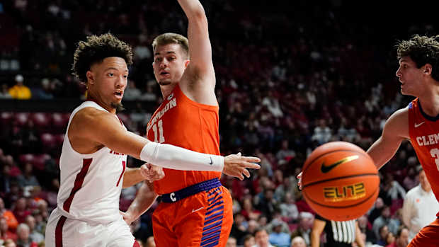 Nov 28, 2023; Tuscaloosa, Alabama, USA; Alabama Crimson Tide guard Mark Sears (1) passes around Clemson Tigers guard Joseph Girard III (11) at Coleman Coliseum.