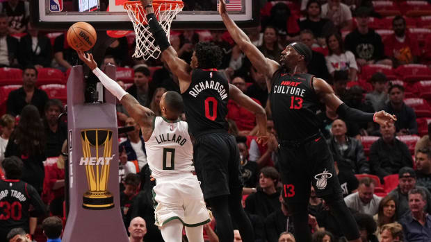 Milwaukee Bucks guard Damian Lillard (0) puts up a shot against Miami Heat guard Josh Richardson (0)