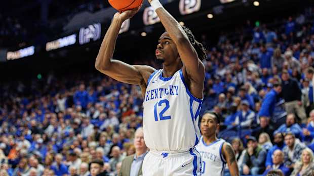 Nov 28, 2023; Lexington, Kentucky, USA; Kentucky Wildcats guard Antonio Reeves (12) shoots the ball during the second half against the Miami (Fl) Hurricanes at Rupp Arena at Central Bank Center. Mandatory Credit: Jordan Prather-USA TODAY Sports