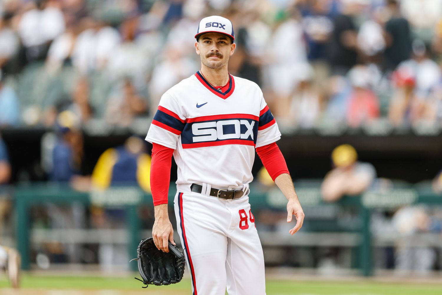 Aug 13, 2023; Chicago, Illinois, USA; Chicago White Sox starting pitcher Dylan Cease (84) walks back to dugout after pitching against the Milwaukee Brewers during the first inning at Guaranteed Rate Field.