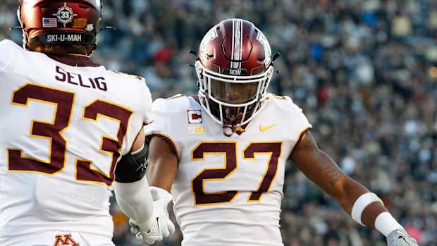 Minnesota Golden Gophers linebacker Ryan Selig (33) and Minnesota Golden Gophers defensive back Tyler Nubin (27) celebrate a defensive stop during the NCAA football game against the Purdue Boilermakers, Saturday, Nov. 11, 2023, at Ross-Ade Stadium in West Lafayette, Ind. Purdue Boilermakers won 49-30.