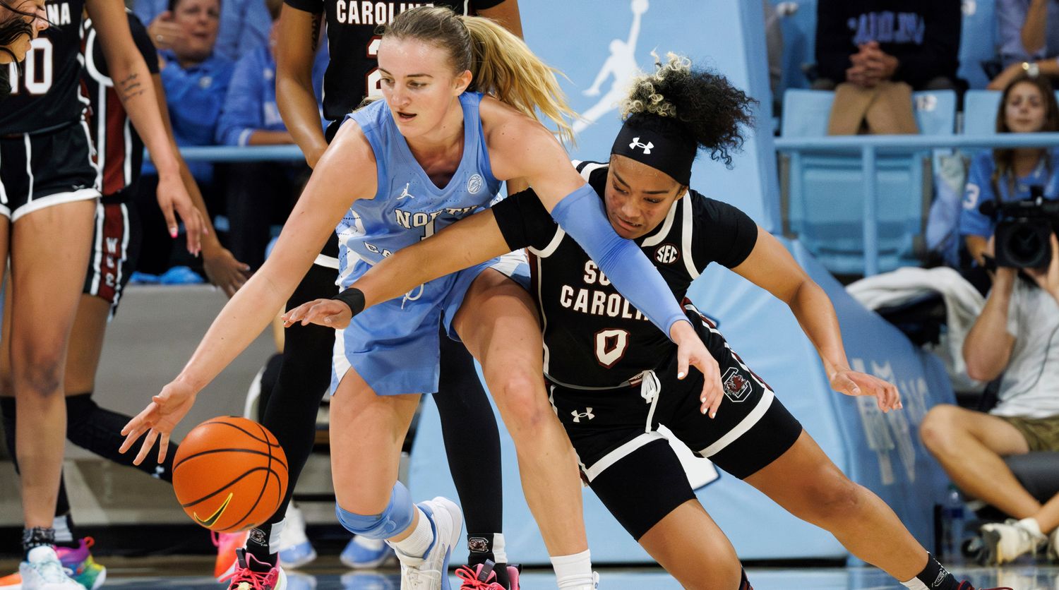 South Carolina's Te-Hina Paopao (0) attempts to steal the ball from North Carolina's Alyssa Ustby during the second half of a game.
