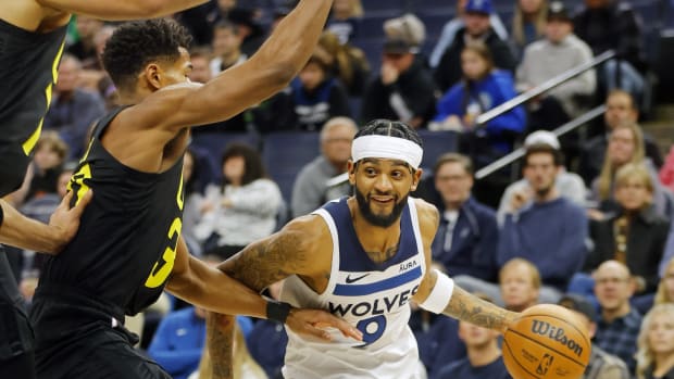 Minnesota Timberwolves guard Nickeil Alexander-Walker (9) works around Utah Jazz guard Ochai Agbaji (30) in the first quarter at Target Center.