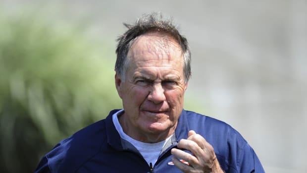 Jun 13, 2017; Foxborough, MA, USA; New England Patriots head coach Bill Belichick walks to the podium to address the media during minicamp at Gillette Stadium practice field. Mandatory Credit: Bob DeChiara-USA TODAY Sports  