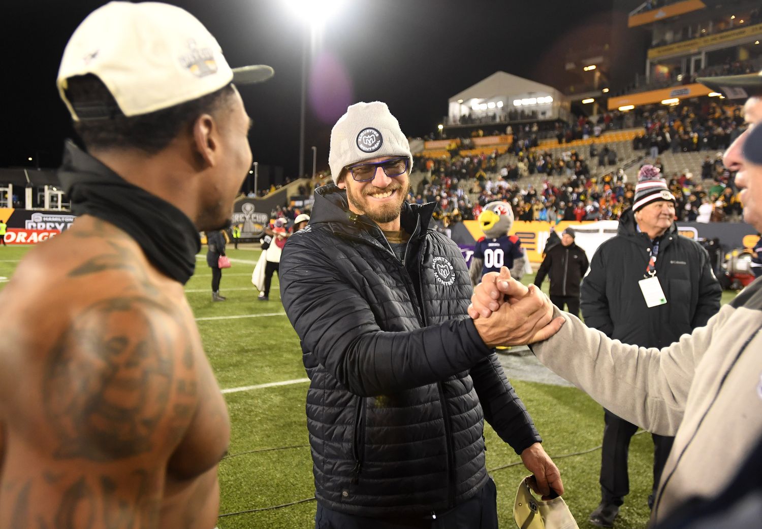 Nov 19, 2023; Hamilton, Ontario, CAN; Montreal Alouettes head coach Jason Maas celebrates with linebacker Tyrice Beverette (26, left) and staff after winning the Grey Cup final against the Winnipeg Blue Bombers at Tim Hortons Field. Mandatory Credit: Dan Hamilton-USA TODAY Sports