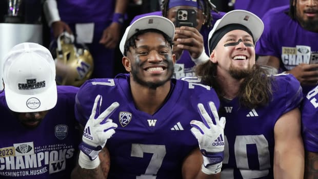 Dillon Johnson and Asa Turner celebrate a Pac-12 championship.