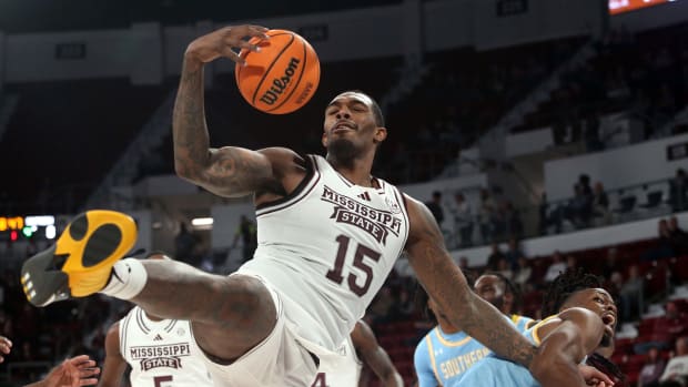 Mississippi State Bulldogs forward Jimmy Bell Jr. (15) collects a rebound over Southern Jaguars forward JaRonn Wilkens (1) during the first half at Humphrey Coliseum.