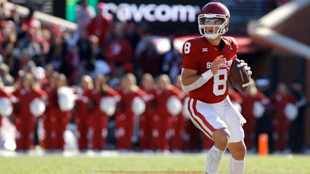 Oklahoma Sooners quarterback Dillon Gabriel (8) drops back to pass during a college football game between the University of Oklahoma Sooners (OU) and the TCU Horned Frogs at Gaylord Family-Oklahoma Memorial Stadium in Norman, Okla., Friday, Nov. 24, 2023. Oklahoma won 69-45.