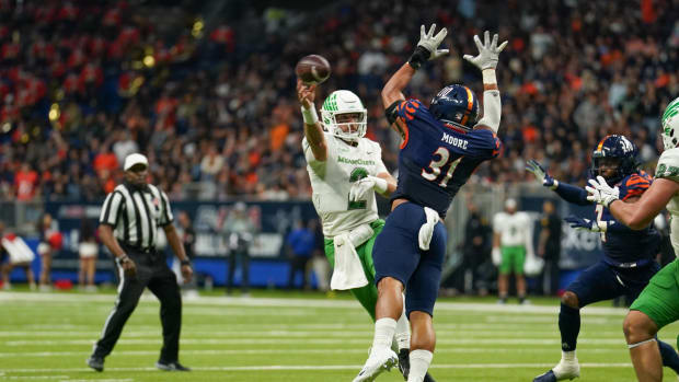 Dec 2, 2022; San Antonio, Texas, USA; North Texas Mean Green quarterback Austin Aune (2) passes in front of UTSA Roadrunners linebacker Trey Moore (31) in the second half at the Alamodome. Mandatory Credit: Daniel Dunn-USA TODAY Sports