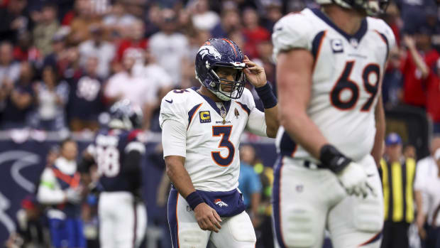 Denver Broncos quarterback Russell Wilson (3) walks off the field after a play during the third quarter against the Houston Texans at NRG Stadium.