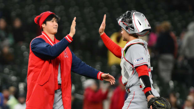Apr 3, 2023; Seattle, Washington, USA; Los Angeles Angels designated hitter Shohei Ohtani (17) and catcher Logan OHoppe (14) celebrate after defeating the Seattle Mariners at T-Mobile Park. Los Angeles defeated Seattle 7-3. Mandatory Credit: Steven Bisig-USA TODAY Sports  