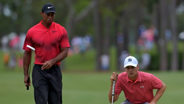 Tiger Woods watches as Jordan Spieth lines up his putt on hole No.1. The Final Round of The Players Championship at TPC Sawgrass Players Stadium Course in Ponte Vedra Beach, FL on Sunday May 13, 2018. (Bob Self/Florida Times-Union) Fl Jax 05playersfin