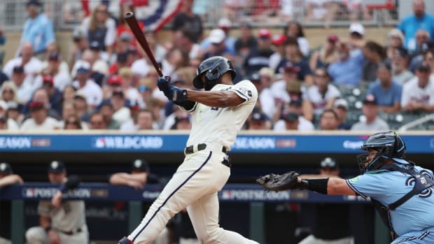 Oct 3, 2023; Minneapolis, Minnesota, USA; Minnesota Twins center fielder Michael A. Taylor (2) hits a single in the second inning against the Toronto Blue Jays during game one of the Wildcard series for the 2023 MLB playoffs at Target Field. Mandatory Credit: Jesse Johnson-USA TODAY Sports  