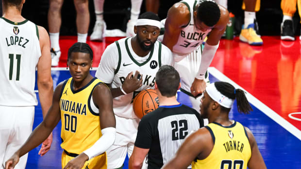 Bobby Portis reacts with surprise while arguing with a referee