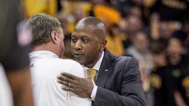 Dec 10, 2022; Columbia, Missouri, USA; Kansas Jayhawks head coach Bill Self, left, embraces Missouri Tigers head coach Dennis Gates after a game at Mizzou Arena.