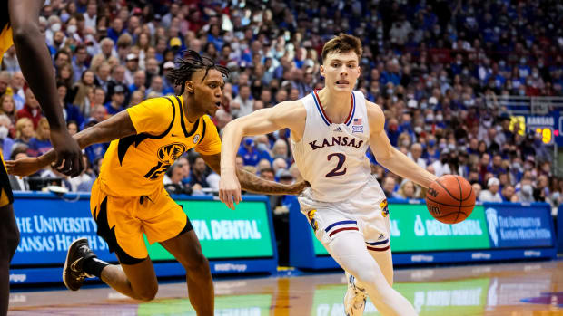 Kansas Jayhawks guard Christian Braun (2) drives against Missouri Tigers guard DaJuan Gordon (12) during the second half at Allen Fieldhouse.