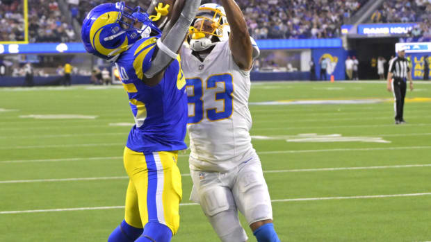 Aug 12, 2023; Inglewood, California, USA; Los Angeles Chargers cornerback Deane Leonard (33) defends a pass intended for Los Angeles Rams tight end Camren McDonald (45) in the end zone in the first half at SoFi Stadium. Mandatory Credit: Jayne Kamin-Oncea-USA TODAY Sports