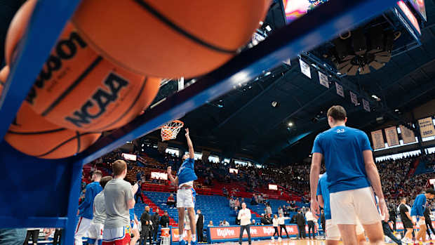 Kansas players warm up before the start of Saturday's HyVee Hoops Border Showdown against Missouri inside Allen Fieldhouse.
