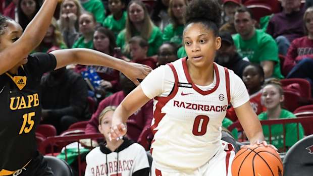 Razorbacks Tahlia Scott drives against UAPB's Corhiah Beck
