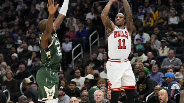 Chicago Bulls forward DeMar DeRozan (11) shoots against Milwaukee Bucks forward Khris Middleton (22) during the second quarter at Fiserv Forum. 