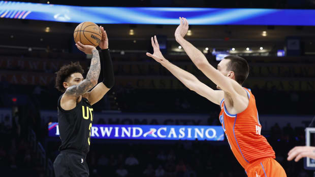 Dec 11, 2023; Oklahoma City, Oklahoma, USA; Utah Jazz guard Keyonte George (3) shoot a three-point basket as Oklahoma City Thunder forward Aleksej Pokusevski (17) defends during the second half at Paycom Center. 