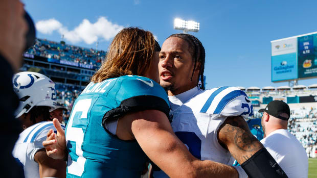 Oct 15, 2023; Jacksonville, Florida, USA; Jacksonville Jaguars quarterback Trevor Lawrence (16) and Indianapolis Colts cornerback JuJu Brents (29) after the game at EverBank Stadium.