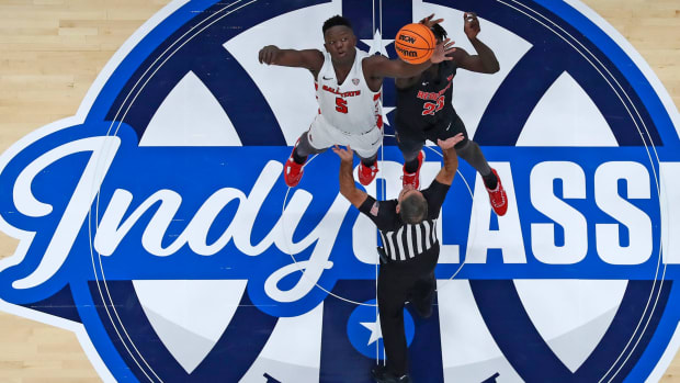 Ball State Cardinals center Payton Sparks (5) and Illinois State Redbirds forward Harouna Sissoko (23) go for the tip off during the Indy Classic NCAA men s basketball doubleheader, Saturday, Dec. 17, 2022, at Gainbridge Fieldhouse in Indianapolis.