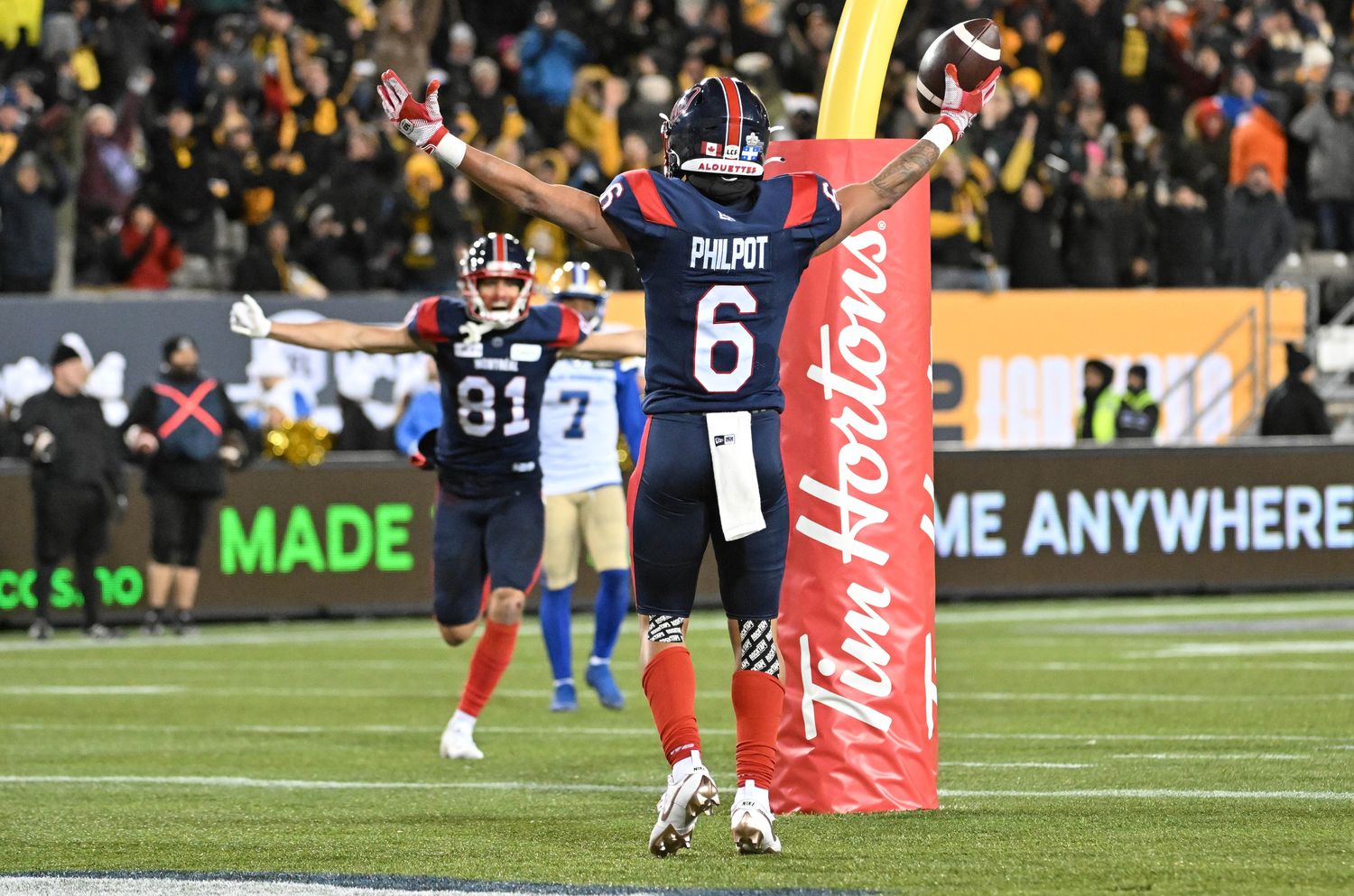 Nov 19, 2023; Hamilton, Ontario, CAN; Montreal Alouettes wide receiver Tyson Philpot (6) celebrates with wide receiver Mack Austin (81) after scoring the winning touchdown against the Winnipeg Blue Bombers with 13 seconds left in the second half at Tim Hortons Field. Mandatory Credit: Dan Hamilton-USA TODAY Sports  