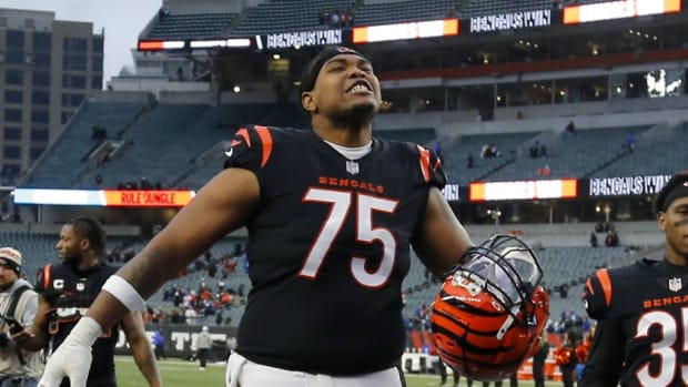 Dec 10, 2023; Cincinnati, Ohio, USA; Cincinnati Bengals offensive tackle Orlando Brown Jr. (75) and cornerback Jalen Davis (35) celebrate the win following the second half against the Indianapolis Colts at Paycor Stadium.