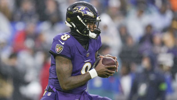 Baltimore Ravens quarterback Lamar Jackson scrambles during a game against the Los Angeles Rams on Dec. 10, 2023.