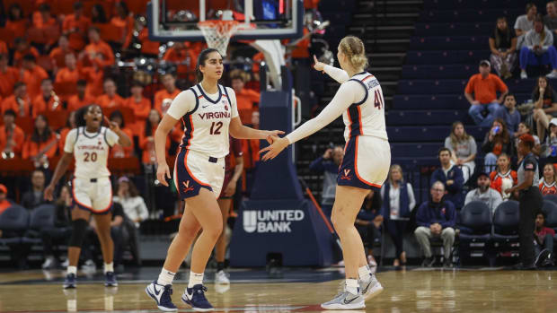 Edessa Noyan shakes hands with Taylor Lauterbach during the Virginia women's basketball game against Maryland Eastern Shore at John Paul Jones Arena.