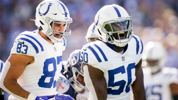 Indianapolis Colts linebacker Segun Olubi (50) celebrates tackling Tennessee Titans running back Tyjae Spears during the first quarter at Nissan Stadium in Nashville, Tenn., Sunday, Dec. 3, 2023.  