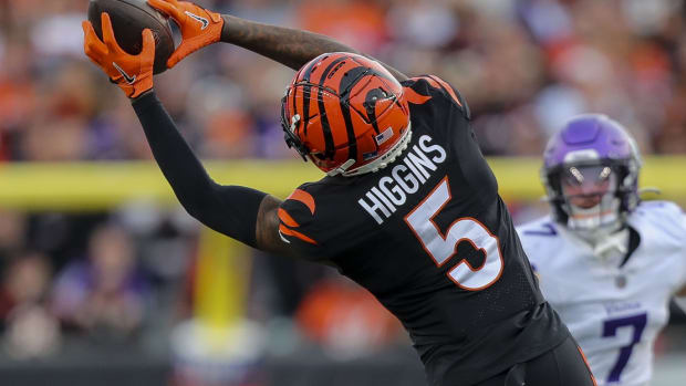 Dec 16, 2023; Cincinnati, Ohio, USA; Cincinnati Bengals wide receiver Tee Higgins (5) catches a pass against the Minnesota Vikings in the second half at Paycor Stadium. Mandatory Credit: Katie Stratman-USA TODAY Sports  