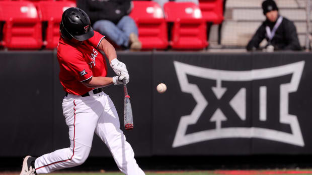 Texas Tech's catcher Kevin Bazzell (4) hits the ball against Gonzaga in game two of the baseball series, Saturday, Feb. 18, 2023, at Rip Griffin Park at Dan Law Field.