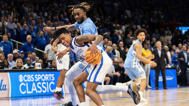 Dec 16, 2023; Atlanta, Georgia, USA; Kentucky Wildcats guard Rob Dillingham (0) dribbles the ball against North Carolina Tar Heels forward Jae'Lyn Withers (24) during the second half at State Farm Arena. Mandatory Credit: Jordan Godfree-USA TODAY Sports