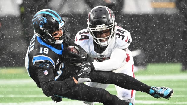 Carolina Panthers wide receiver Adam Thielen (19) is tackled by Atlanta Falcons cornerback Clark Phillips III (34) in the third quarter at Bank of America Stadium.