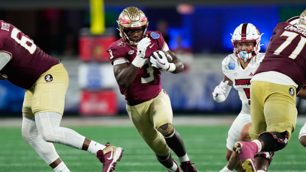 Dec 2, 2023; Charlotte, NC, USA; Florida State Seminoles running back Trey Benson (3) runs the ball against the Louisville Cardinals during the fourth quarter at Bank of America Stadium. Mandatory Credit: Jim Dedmon-USA TODAY Sports  