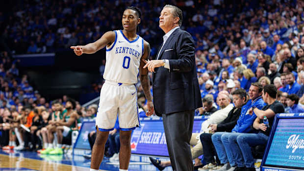 Nov 28, 2023; Lexington, Kentucky, USA; Kentucky Wildcats guard Rob Dillingham (0) talks with head coach John Calipari during the first half against the Miami (Fl) Hurricanes at Rupp Arena at Central Bank Center. Mandatory Credit: Jordan Prather-USA TODAY Sports
