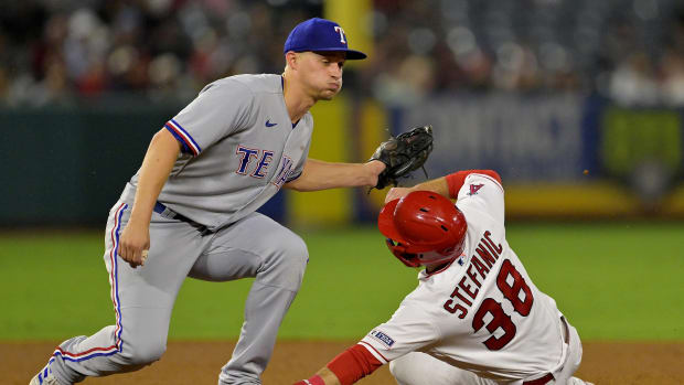 Sep 25, 2023; Anaheim, California, USA; Los Angeles Angels second baseman Michael Stefanic (38) is tagged out on a stolen base attempt by Texas Rangers shortstop Corey Seager (5) in the fifth inning at Angel Stadium. Mandatory Credit: Jayne Kamin-Oncea-USA TODAY Sports  